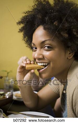 Woman eating View Large Photo Image Stock Image - Woman eating. Fotosearch