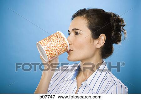 Stock Photo - Woman enjoying a mug of coffee. Fotosearch