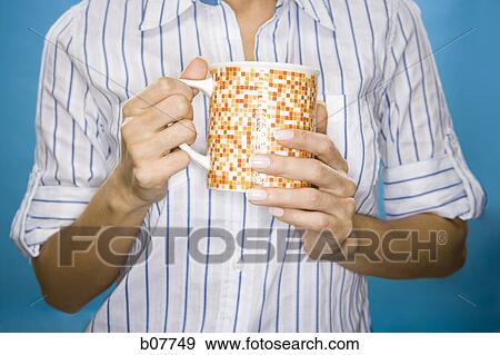 Stock Photo - Woman enjoying a mug of coffee. Fotosearch
