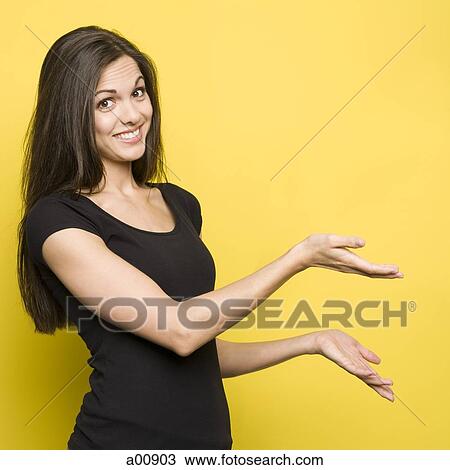 Stock Image - Woman gesturing with her arms. Fotosearch