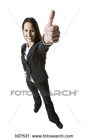 Woman giving thumbs up gesture View Large Photo Image Stock Image - Woman giving thumbs up gesture. Fotosearch