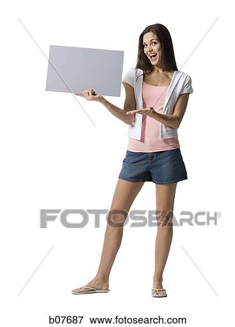 Stock Photo - Woman holding a blank sign. Fotosearch