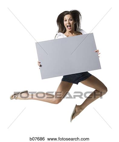 Woman holding a blank sign View Large Photo Image Stock Photograph - Woman holding a blank sign. Fotosearch