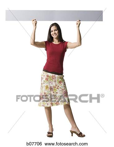 Woman holding a blank sign View Large Photo Image Stock Photograph - Woman holding a blank sign. Fotosearch