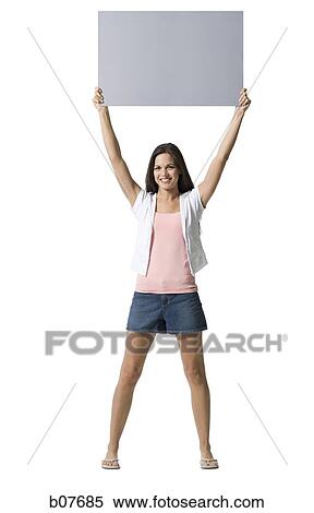 Woman holding a blank sign View Large Photo Image Stock Photography - Woman holding a blank sign. Fotosearch