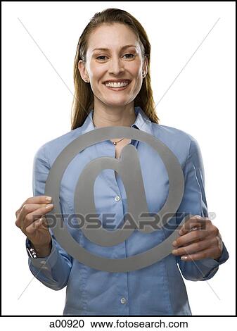Woman holding At-sign View Large Photo Image Stock Image - Woman holding At-sign. Fotosearch
