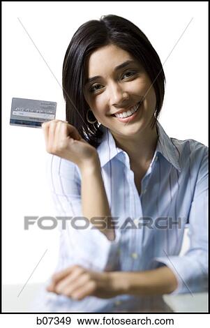 Woman holding credit card View Large Photo Image Stock Photo - Woman holding credit card. Fotosearch