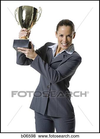 Woman holding trophy View Large Photo Image Stock Photo - Woman holding trophy. Fotosearch