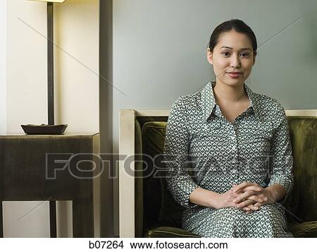 Woman in hotel lobby View Large Photo Image Picture - Woman in hotel lobby. Fotosearch
