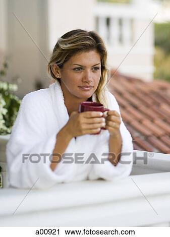 Woman in housecoat relaxing outdoors View Large Photo Image Stock Image - Woman in housecoat relaxing outdoors. Fotosearch