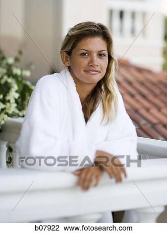 Woman in housecoat relaxing outdoors View Large Photo Image Stock Image - Woman in housecoat relaxing outdoors. Fotosearch