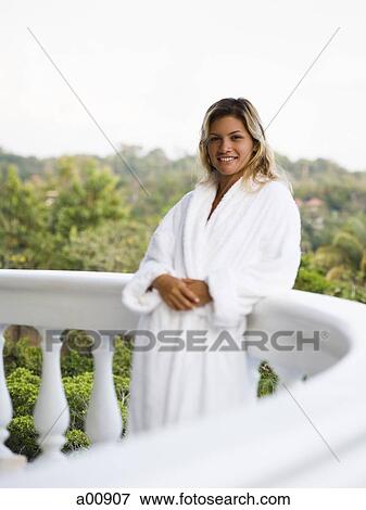 Woman in housecoat relaxing outdoors View Large Photo Image Stock Photo - Woman in housecoat relaxing outdoors. Fotosearch