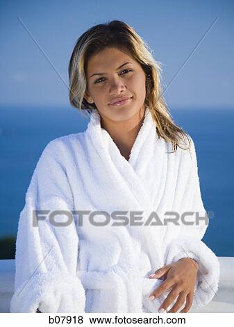 Woman in housecoat relaxing outdoors View Large Photo Image Stock Photo - Woman in housecoat relaxing outdoors. Fotosearch