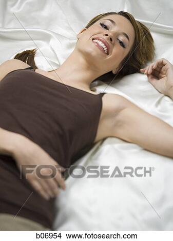 Woman in reclined position View Large Photo Image Picture - Woman in reclined position. Fotosearch