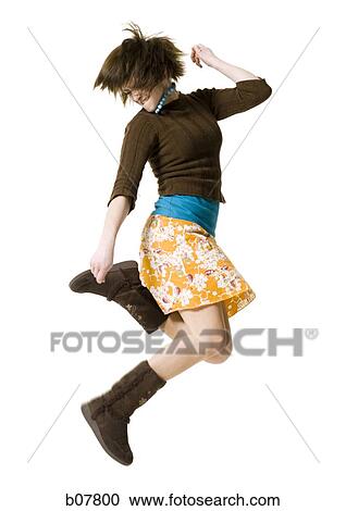Stock Image - Woman jumping. Fotosearch