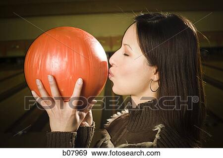 Woman kissing a bowling ball View Large Photo Image Stock Photo - Woman kissing a bowling ball. Fotosearch