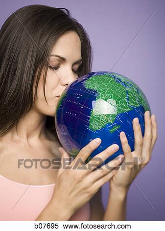Woman kissing earth globe View Large Photo Image Stock Photography - Woman kissing earth globe. Fotosearch