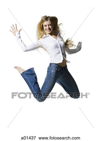 Stock Photo - Woman leaping and smiling. Fotosearch