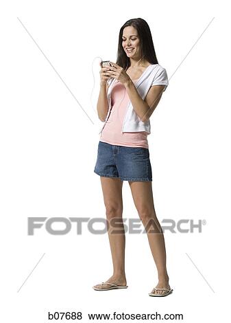 Woman listening to MP3 player View Large Photo Image Stock Photo - Woman listening to MP3 player. Fotosearch