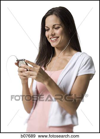 Woman listening to MP3 player View Large Photo Image Stock Photo - Woman listening to MP3 player. Fotosearch