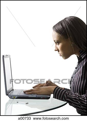 Woman on a laptop View Large Photo Image Stock Image - Woman on a laptop. Fotosearch