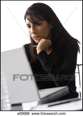 Stock Photo - Woman on a laptop. Fotosearch