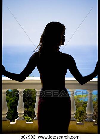 Woman on balcony overlooking ocean View Large Photo Image Stock Image - Woman on balcony overlooking ocean. Fotosearch