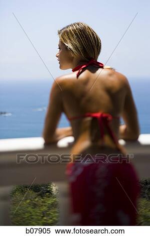 Woman on balcony overlooking ocean View Large Photo Image Stock Photography - Woman on balcony overlooking ocean. Fotosearch