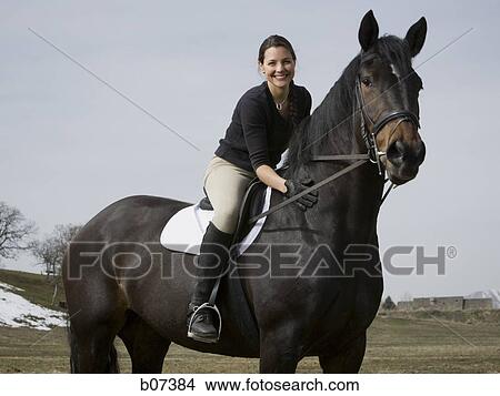 Woman on horseback View Large Photo Image Picture - Woman on horseback. Fotosearch