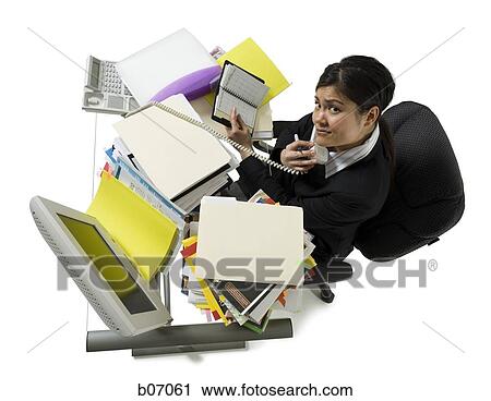 Stock Image - Woman on telephone with calendar planner. Fotosearch