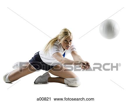 Woman playing volleyball View Large Photo Image Stock Image - Woman playing volleyball. Fotosearch