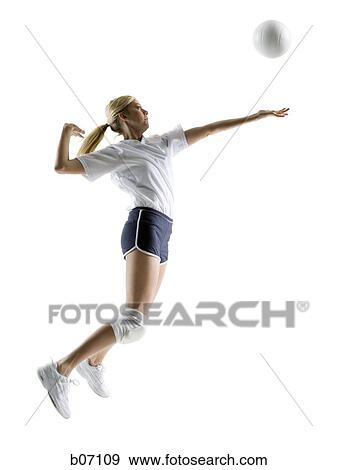 Woman playing volleyball View Large Photo Image Stock Photo - Woman playing volleyball. Fotosearch