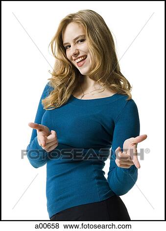 Woman pointing and smiling View Large Photo Image Stock Photo - Woman pointing and smiling. Fotosearch