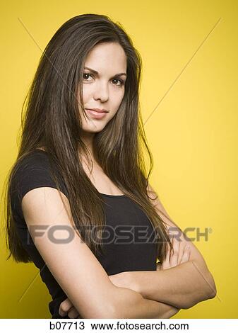 Woman posing with arms folded View Large Photo Image Stock Image - Woman posing with arms folded. Fotosearch