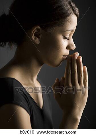Woman praying View Large Photo Image Stock Image - Woman praying. Fotosearch