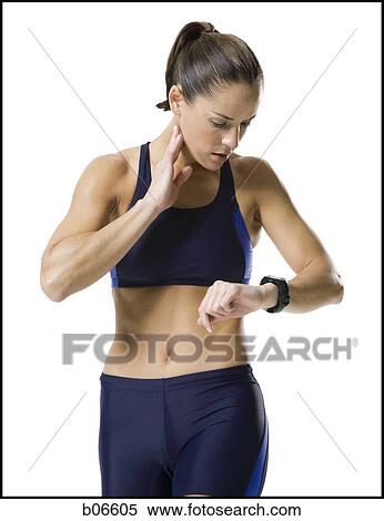 Woman reading watch View Large Photo Image Stock Photography - Woman reading watch. Fotosearch