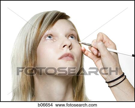 Woman receiving cosmetic application View Large Photo Image Picture - Woman receiving cosmetic application. Fotosearch