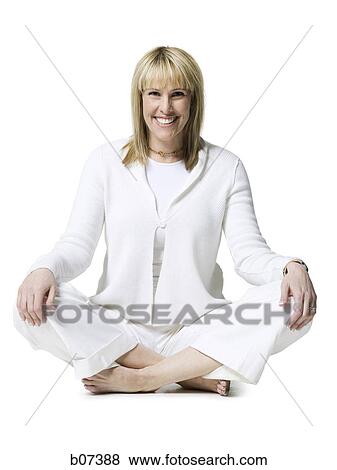 Stock Photo - Woman sitting and smiling. Fotosearch