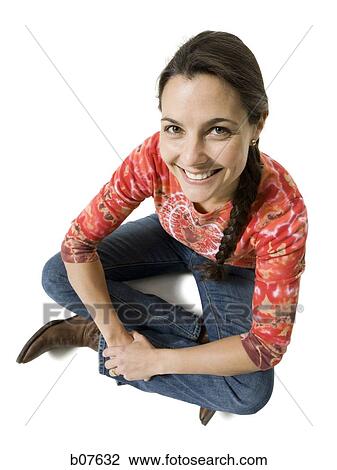 Woman sitting cross legged View Large Photo Image Stock Image - Woman sitting cross legged. Fotosearch