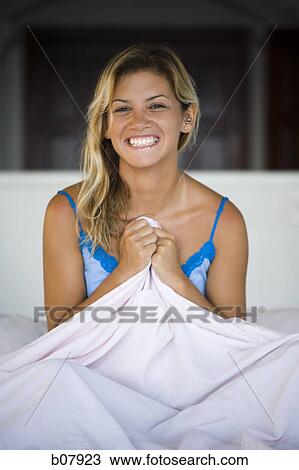 Woman sitting in bed View Large Photo Image Stock Image - Woman sitting in bed. Fotosearch