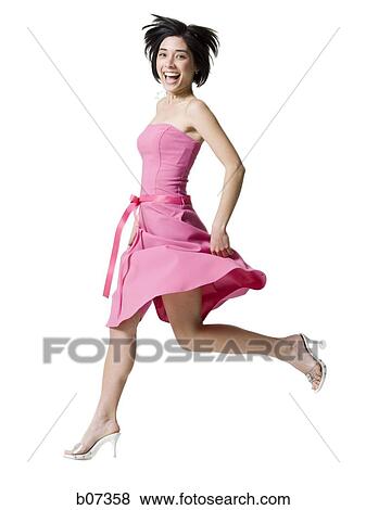 Woman smiling and running with high heels View Large Photo Image Stock Photo - Woman smiling and running with high heels. Fotosearch