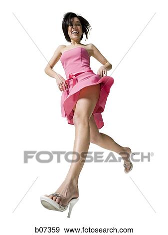 Woman smiling and running with high heels View Large Photo Image Stock Photo - Woman smiling and running with high heels. Fotosearch