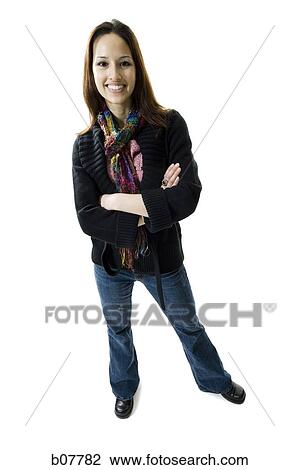 Woman standing and posing with folded arms View Large Photo Image Stock Image - Woman standing and posing with folded arms. Fotosearch