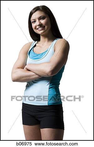 Woman standing with arms crossed View Large Photo Image Stock Photography - Woman standing with arms crossed. Fotosearch