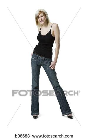 Woman standing with hand on pocket View Large Photo Image Stock Image - Woman standing with hand on pocket. Fotosearch