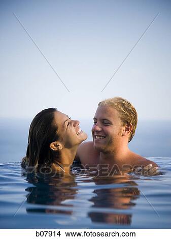 Woman standing with ocean in background View Large Photo Image Picture - Woman standing with ocean in background. Fotosearch