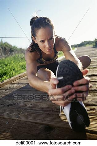 Woman stretching View Large Photo Image Stock Image - Woman stretching. Fotosearch