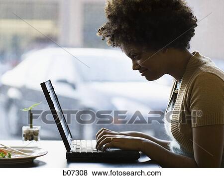 Woman typing on laptop View Large Photo Image Stock Photo - Woman typing on laptop. Fotosearch
