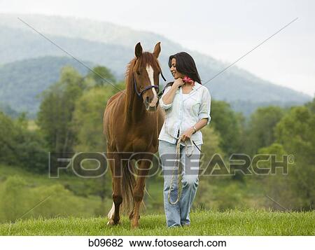 woman walking with a horse View Large Photo Image Stock Image - woman walking with a horse. Fotosearch