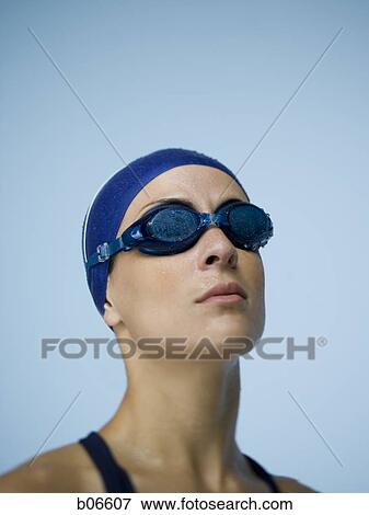 Woman with bathing cap and goggles View Large Photo Image Stock Photo - Woman with bathing cap and goggles. Fotosearch